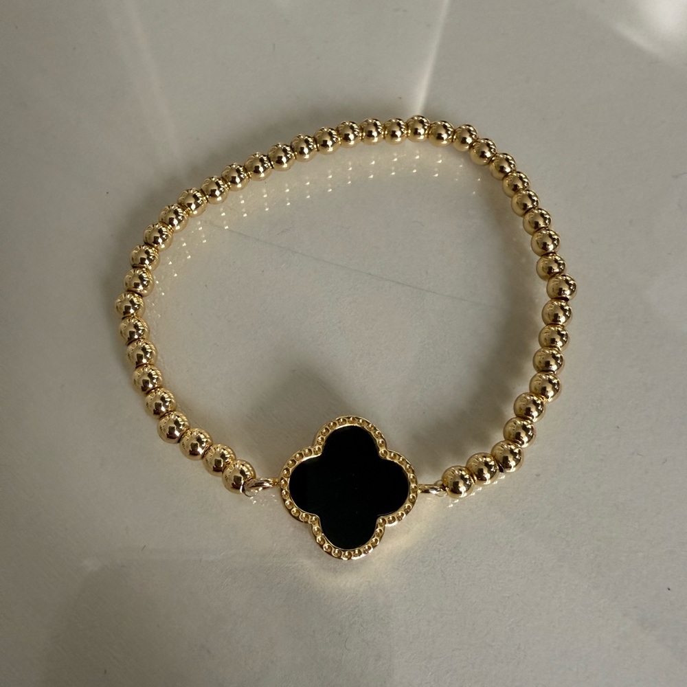 Gold-Tone Beaded Bracelet with Black Clover Charm